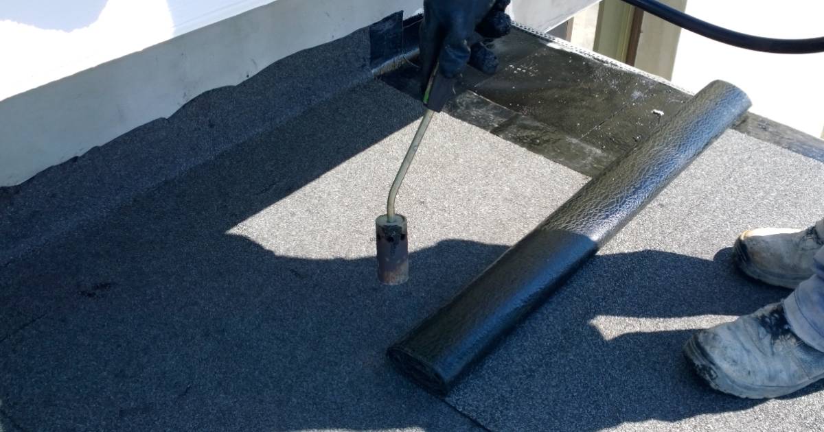 Waterproofing during a flat roof installation in Tucson