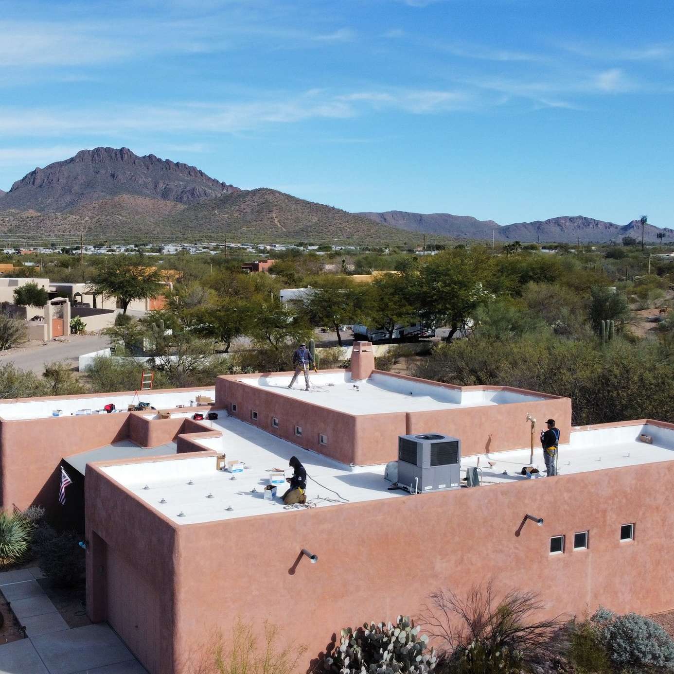 Saguaro Solar experts inspecting a roof in Tucson