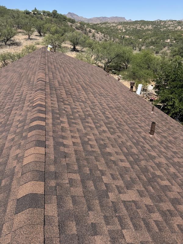 New asphalt shingle roof and ridge cap on a Tucson home in the desert hills