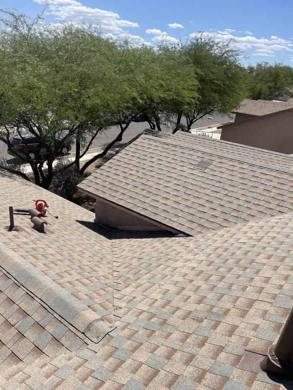 Roof vents and flashing on an asphalt shingle roof in Tucson